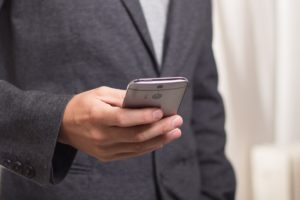 man in suit on cell phone